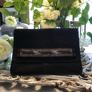 A black authentic Ugg clutch